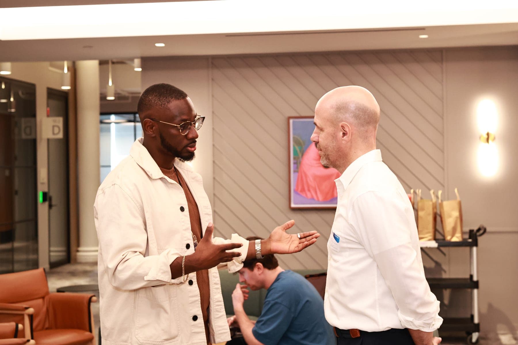 A founder and an investor in conversation at a Founders & Funders event